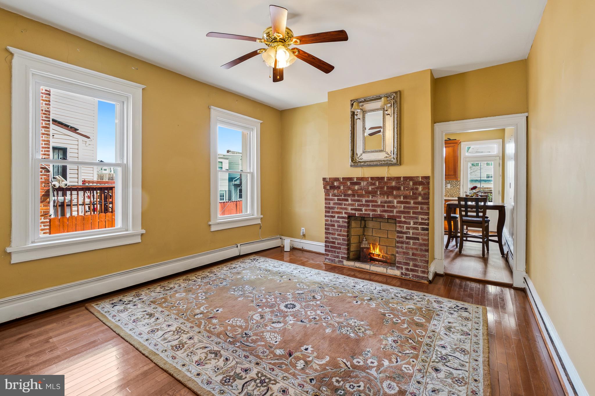 323 W Street Northeast Washington, DC 20002 - Photo 3 of 22 a view of an empty room with a fireplace and a window