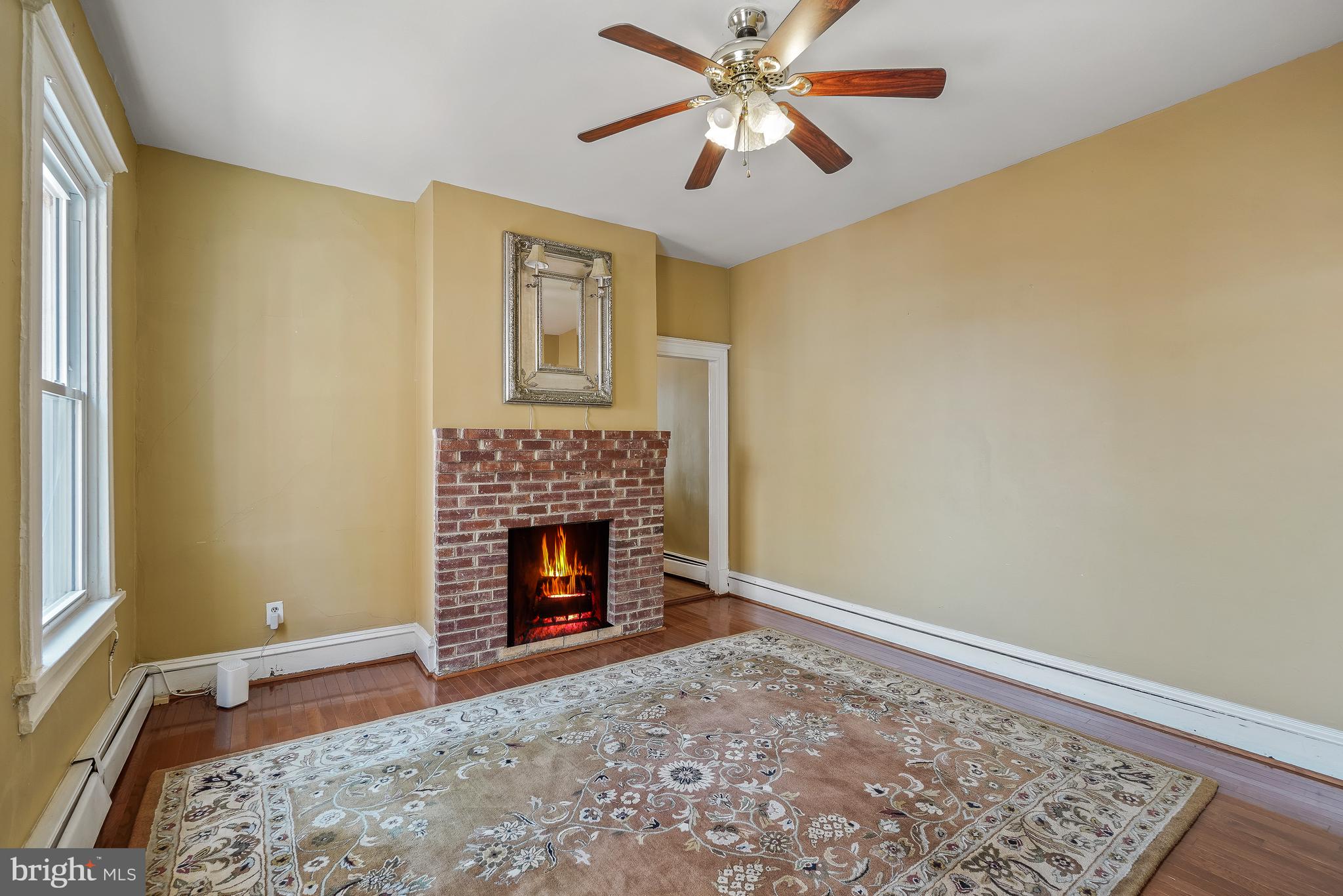 323 W Street Northeast Washington, DC 20002 - Photo 4 of 22 a view of empty room with fireplace and fan