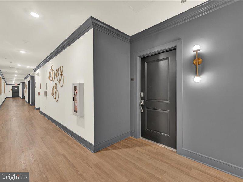 4005 Seaside Alder Road, Unit D Bowie, MD 20720 - Photo 4 of 41 a view of a hallway with wooden floor