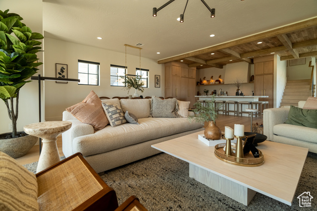 5366 Cyan Lane St. George, UT 84790 - Photo 12 of 39 Living area featuring beamed ceiling, recessed lighting, stairway, and wood finished floors
