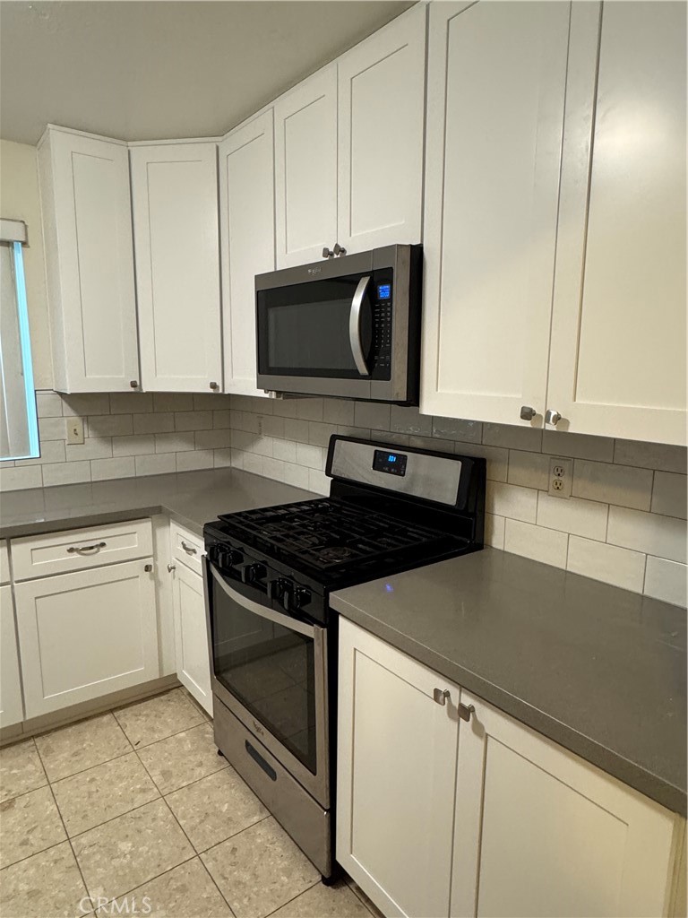 1731 Starboard Way Perris, CA 92571 - Photo 11 of 19 a kitchen with granite countertop cabinets stainless steel appliances and a sink