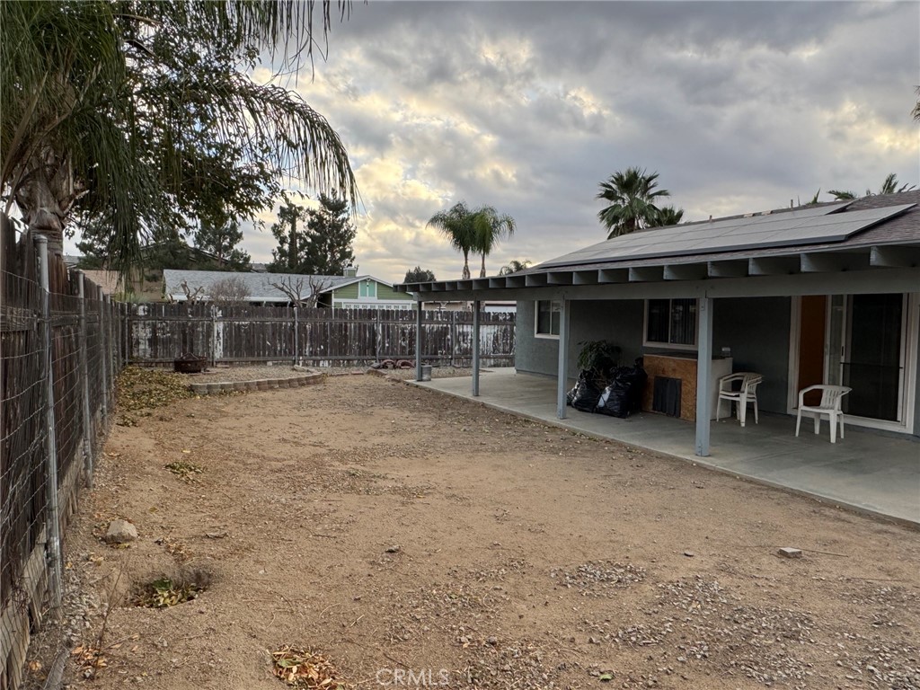 1731 Starboard Way Perris, CA 92571 - Photo 17 of 19 a backyard of a house with table and chairs