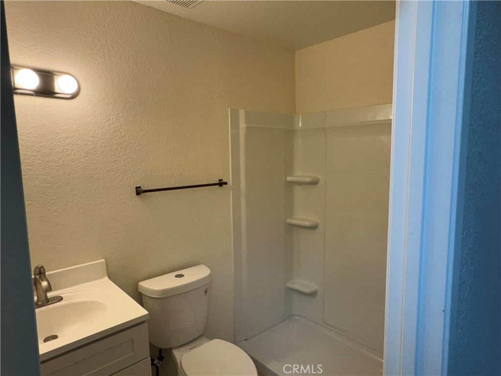 1731 Starboard Way Perris, CA 92571 - Photo 2 of 19 a bathroom with a toilet and a shower