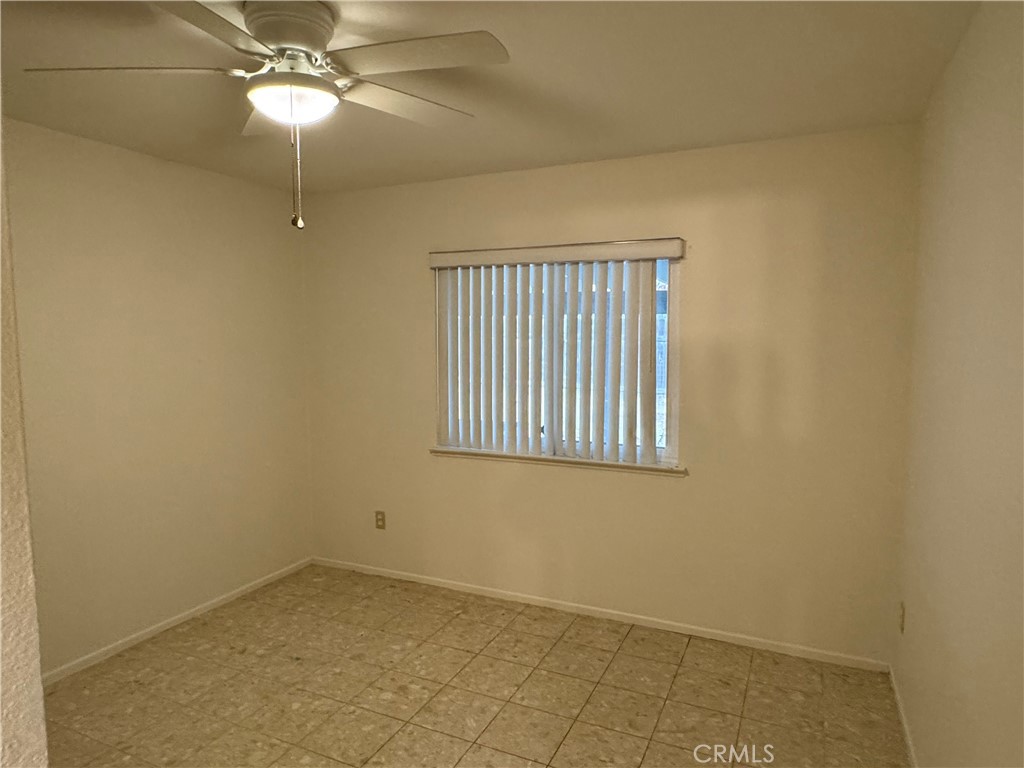 1731 Starboard Way Perris, CA 92571 - Photo 7 of 19 a view of an empty room with a window