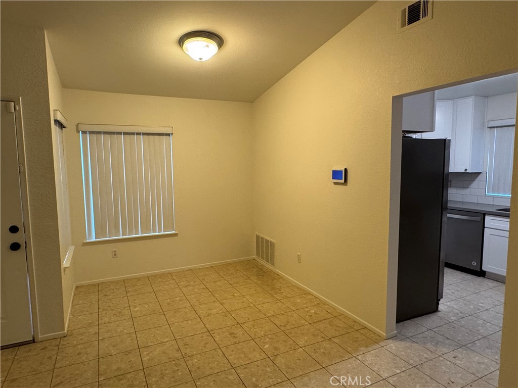 1731 Starboard Way Perris, CA 92571 - Photo 10 of 19 a view of an empty room with a kitchen