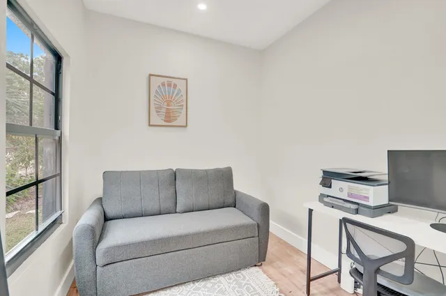 a living room with furniture and a window