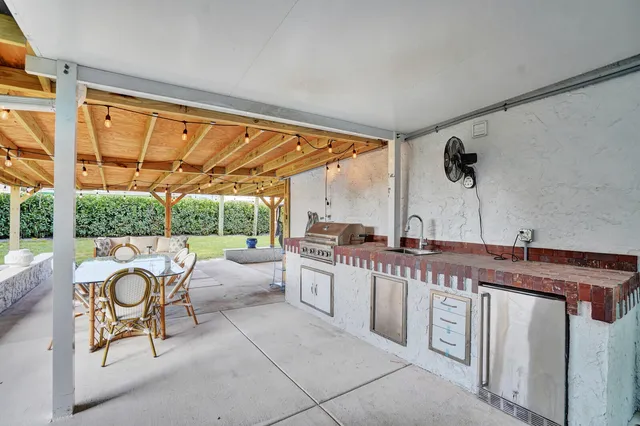 a kitchen with a large window and a sink