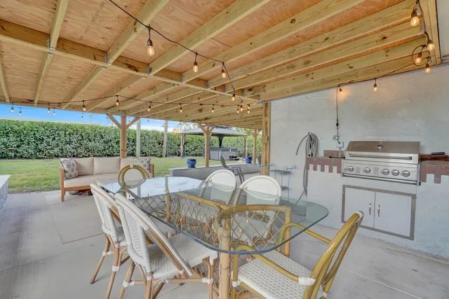 a outdoor space with patio the couches and pool table and chairs