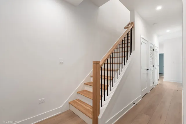 a view of a hallway with stairs