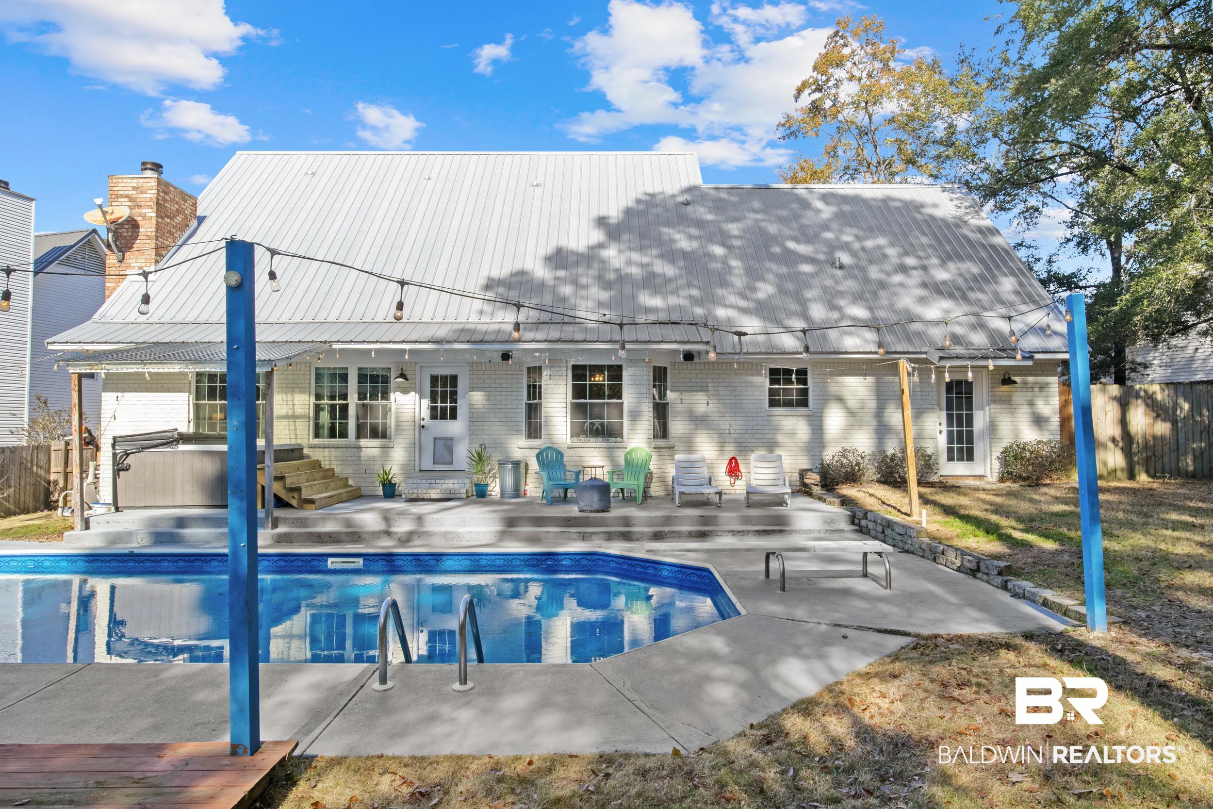 131 Marikesh Drive Daphne, AL 36526 - Photo 29 of 29 Back of house featuring a swimming pool with hot tub and a patio