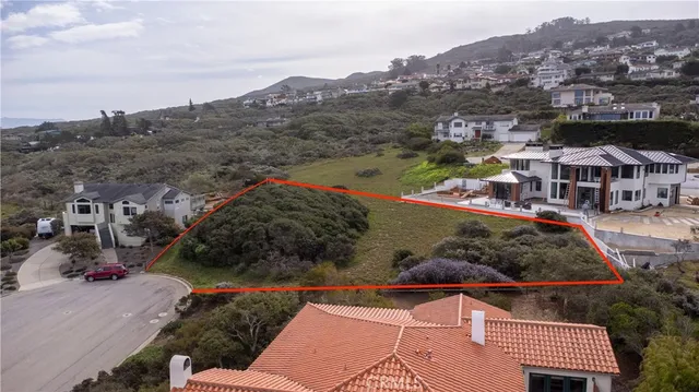 an aerial view of residential houses and city street