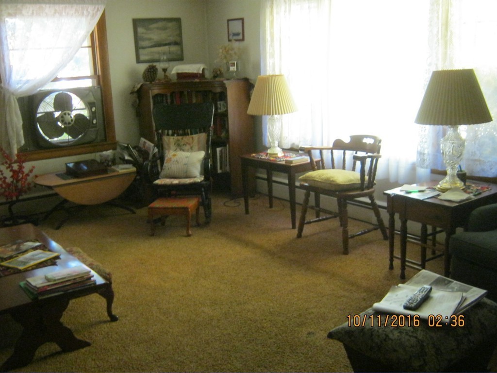 471 Wheeler Road Ashby, MA 01431 - Photo 8 of 22 a living room with furniture and a table