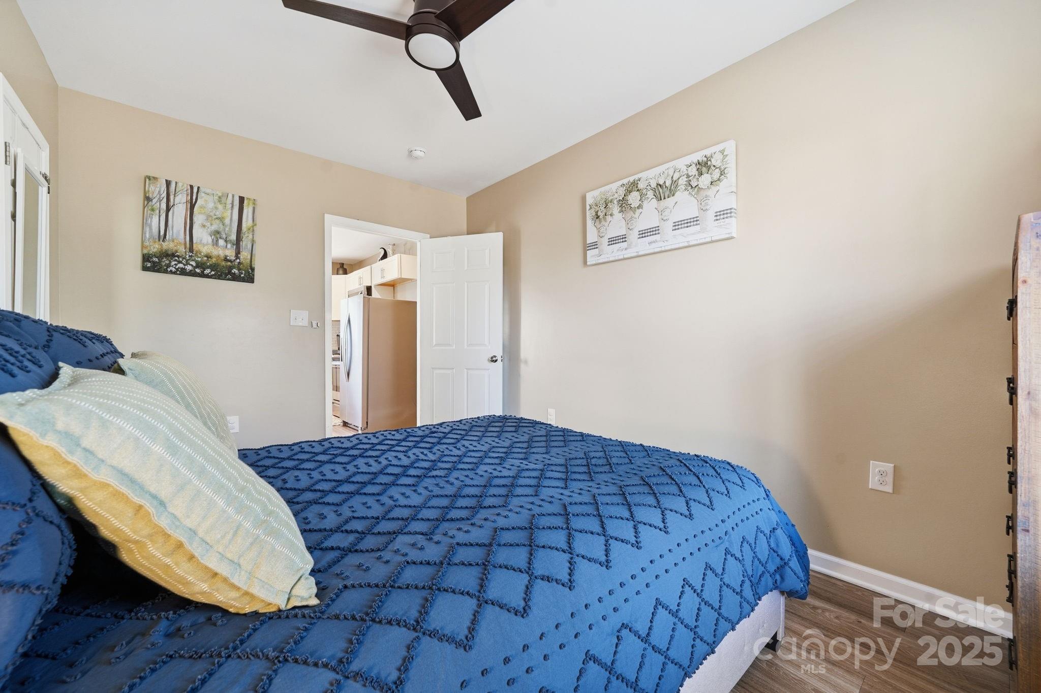 2301 Acme Road Belmont, NC 28012 - Photo 14 of 25 a bedroom with a bed and wooden floor