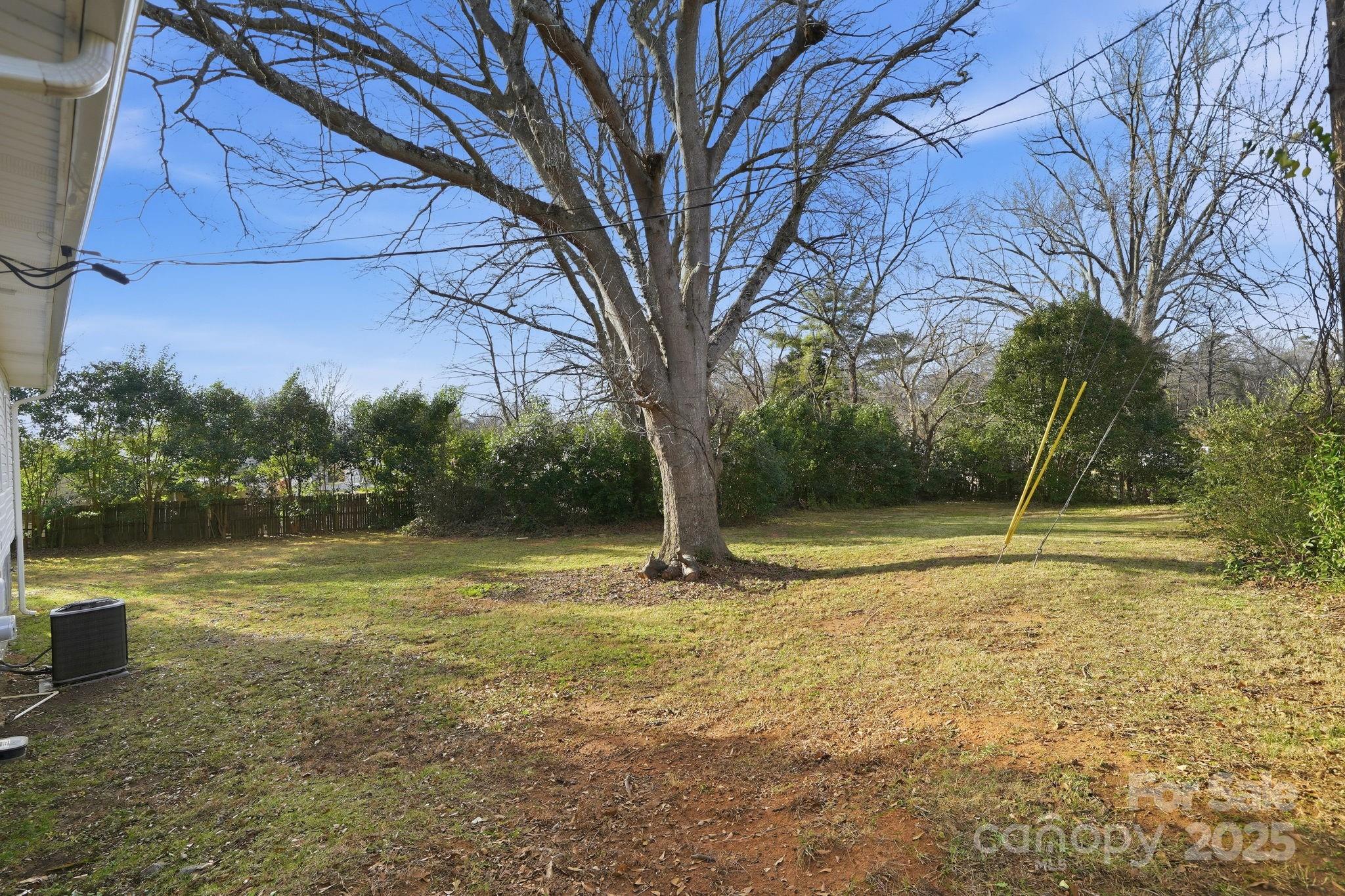 2301 Acme Road Belmont, NC 28012 - Photo 24 of 25 a backyard of a house with lots of green space