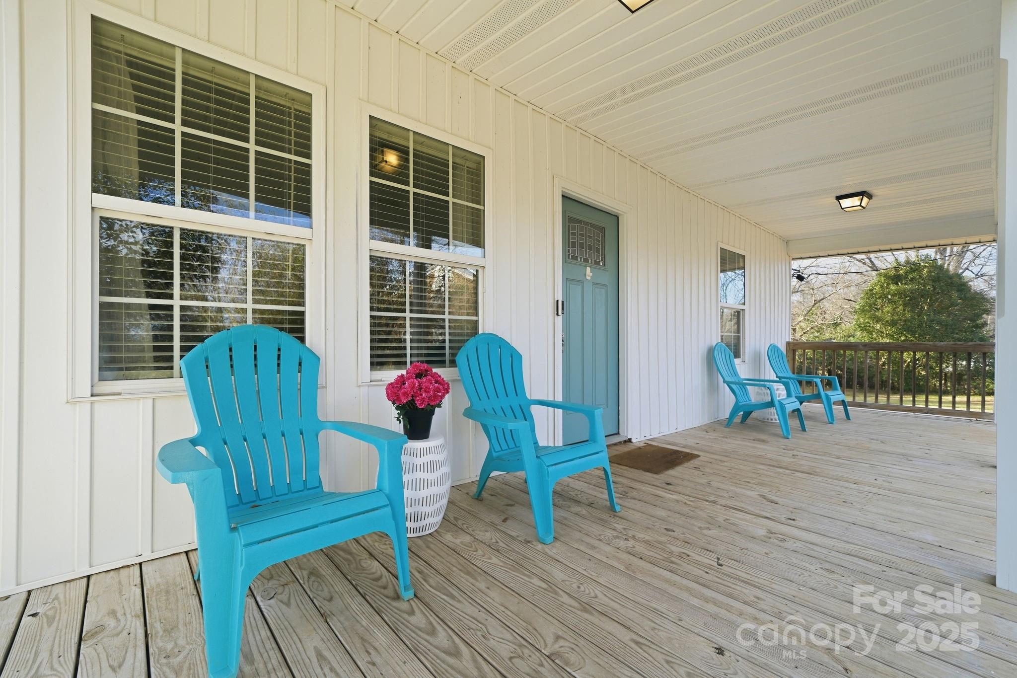 2301 Acme Road Belmont, NC 28012 - Photo 3 of 25 a view of a deck with table and chairs and wooden floor
