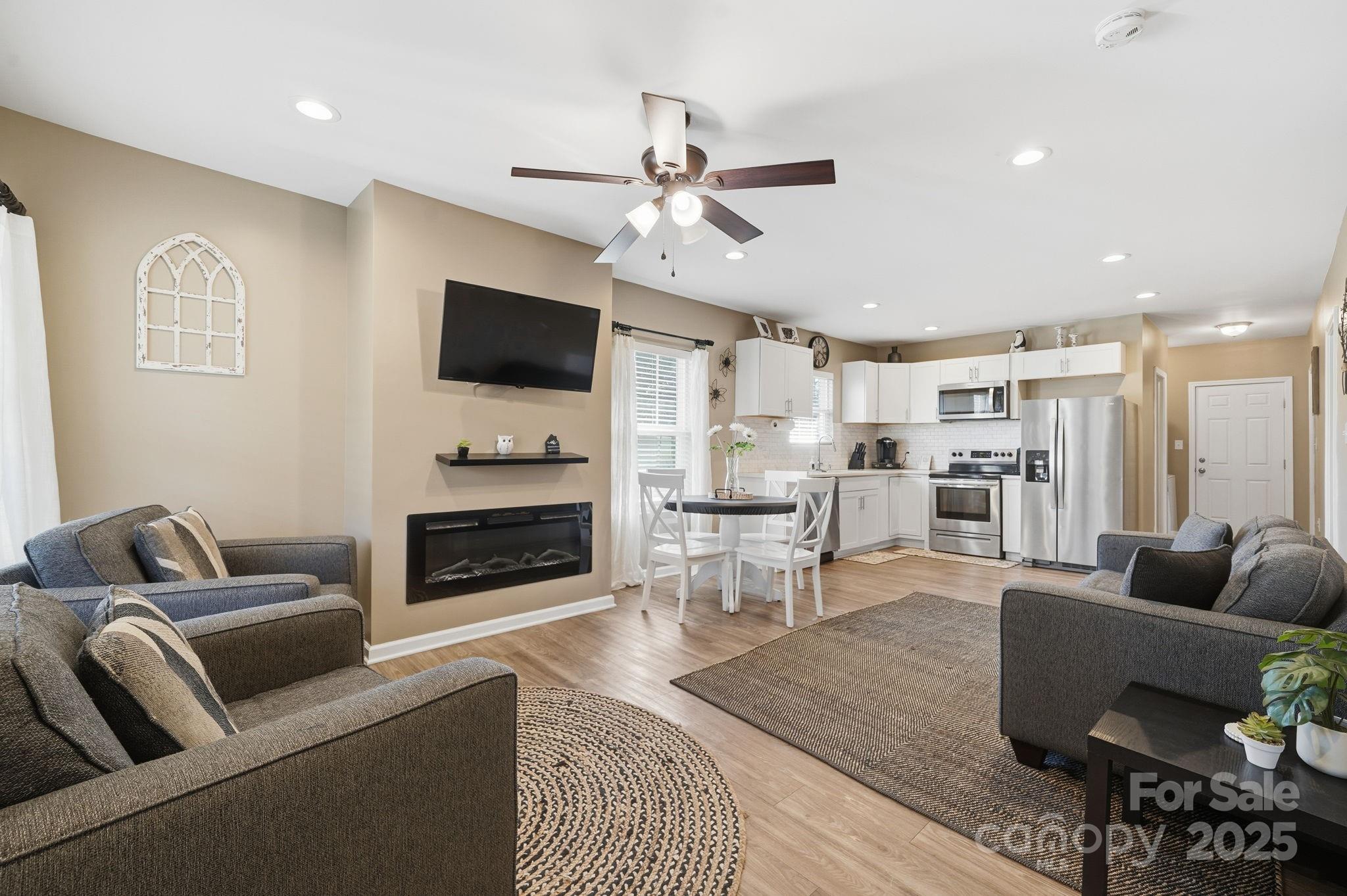 2301 Acme Road Belmont, NC 28012 - Photo 4 of 25 a living room with furniture and a flat screen tv