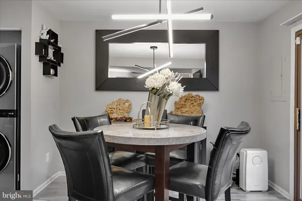 a dining room with furniture and window