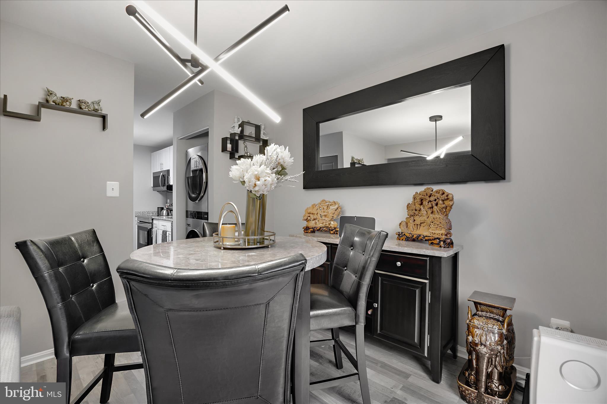 7314 Split Rail Lane Laurel, MD 20707 - Photo 14 of 32 a view of a dining room with furniture and wooden floor