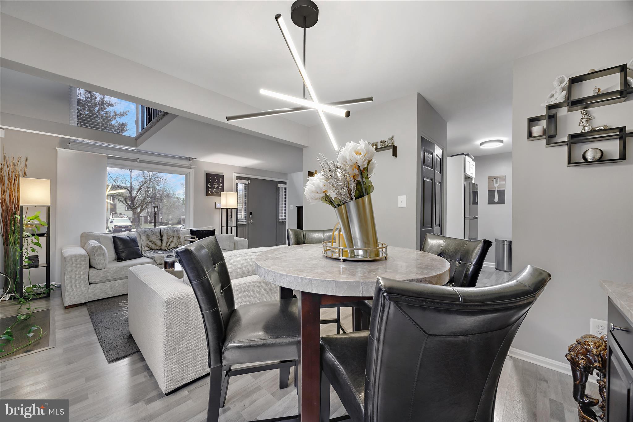 7314 Split Rail Lane Laurel, MD 20707 - Photo 15 of 32 a view of a dining room with furniture and wooden floor