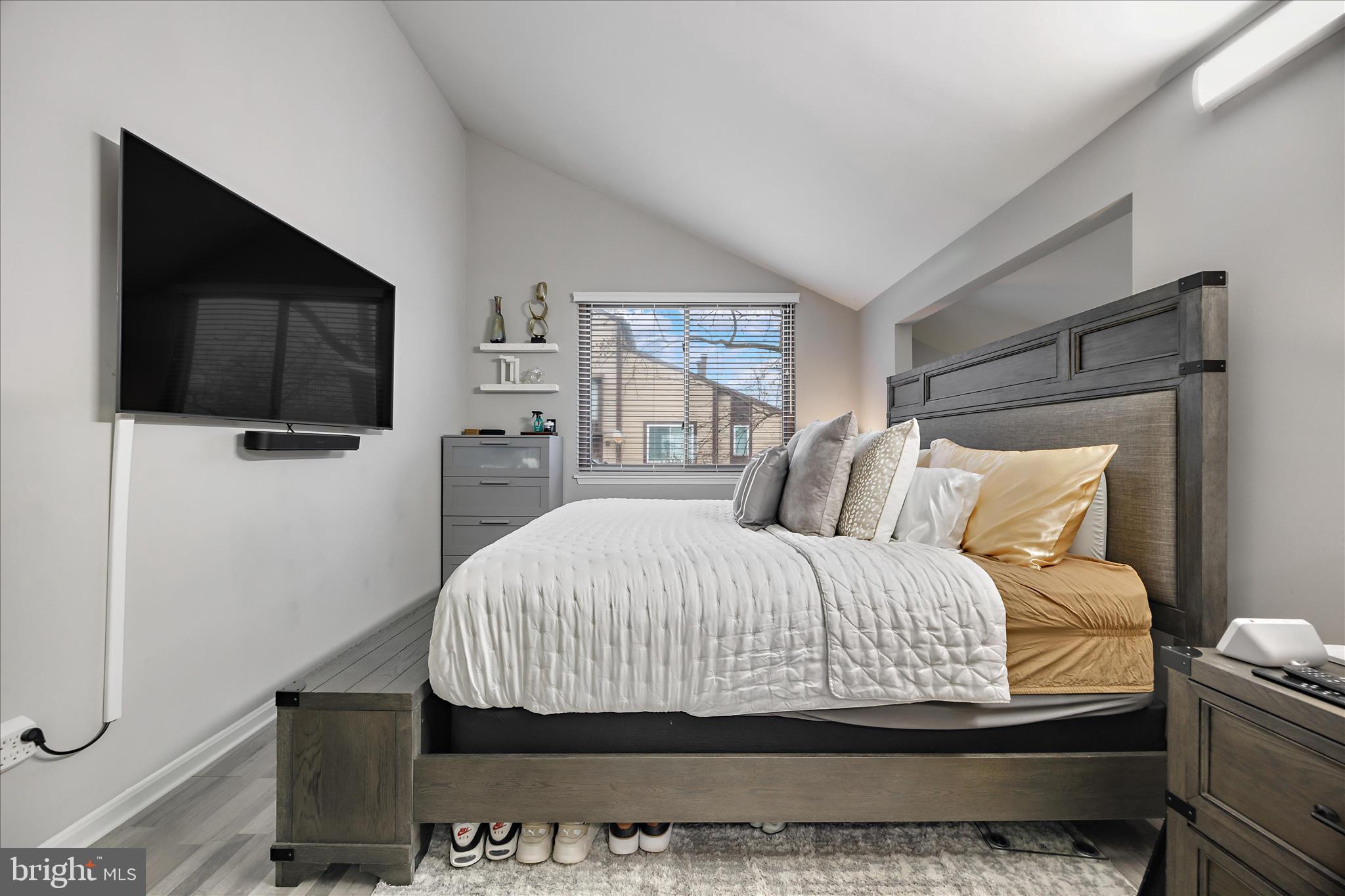 7314 Split Rail Lane Laurel, MD 20707 - Photo 24 of 32 a bedroom with a bed and a flat screen tv