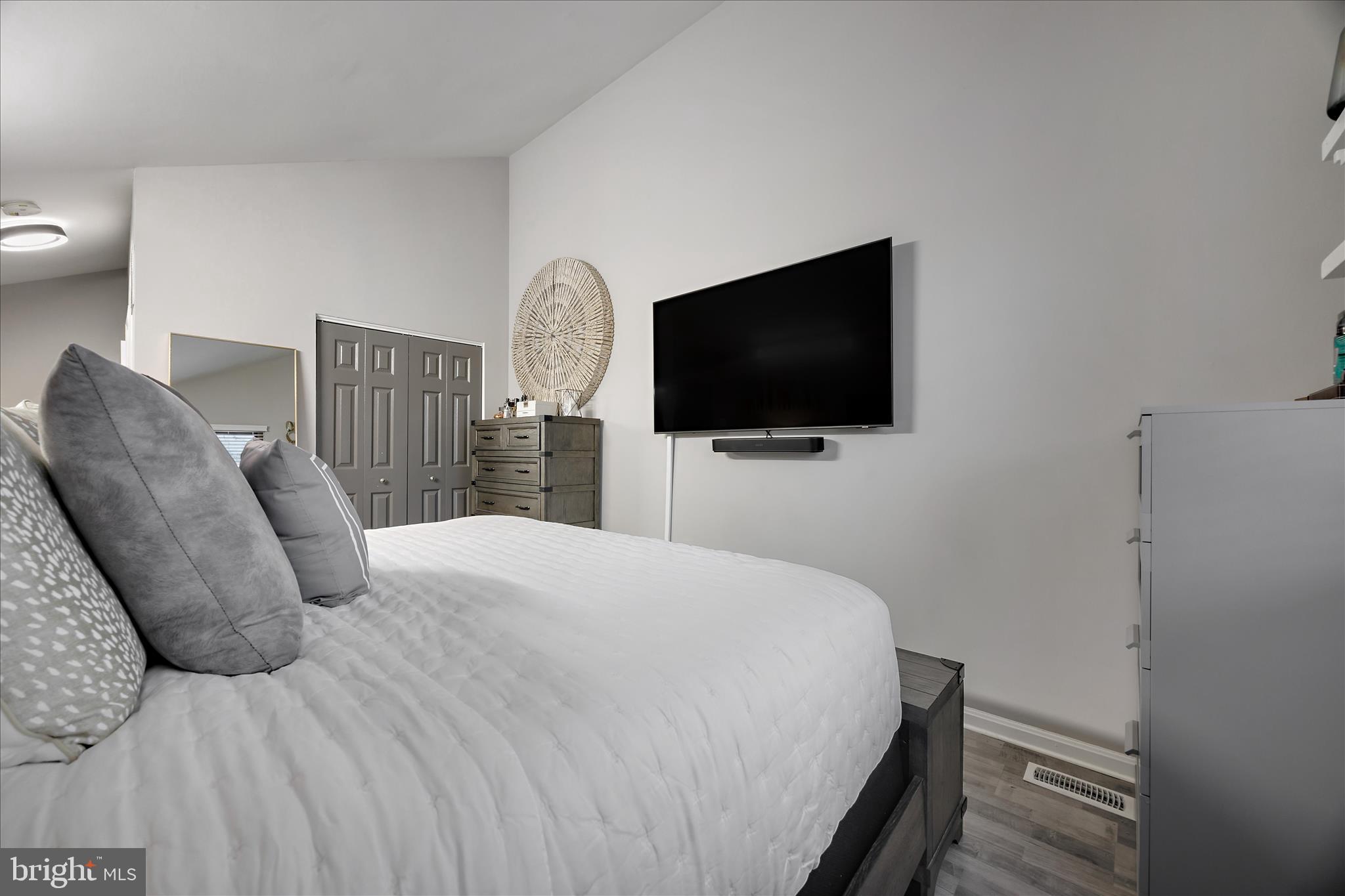 7314 Split Rail Lane Laurel, MD 20707 - Photo 25 of 32 a bedroom with a bed and a flat screen tv