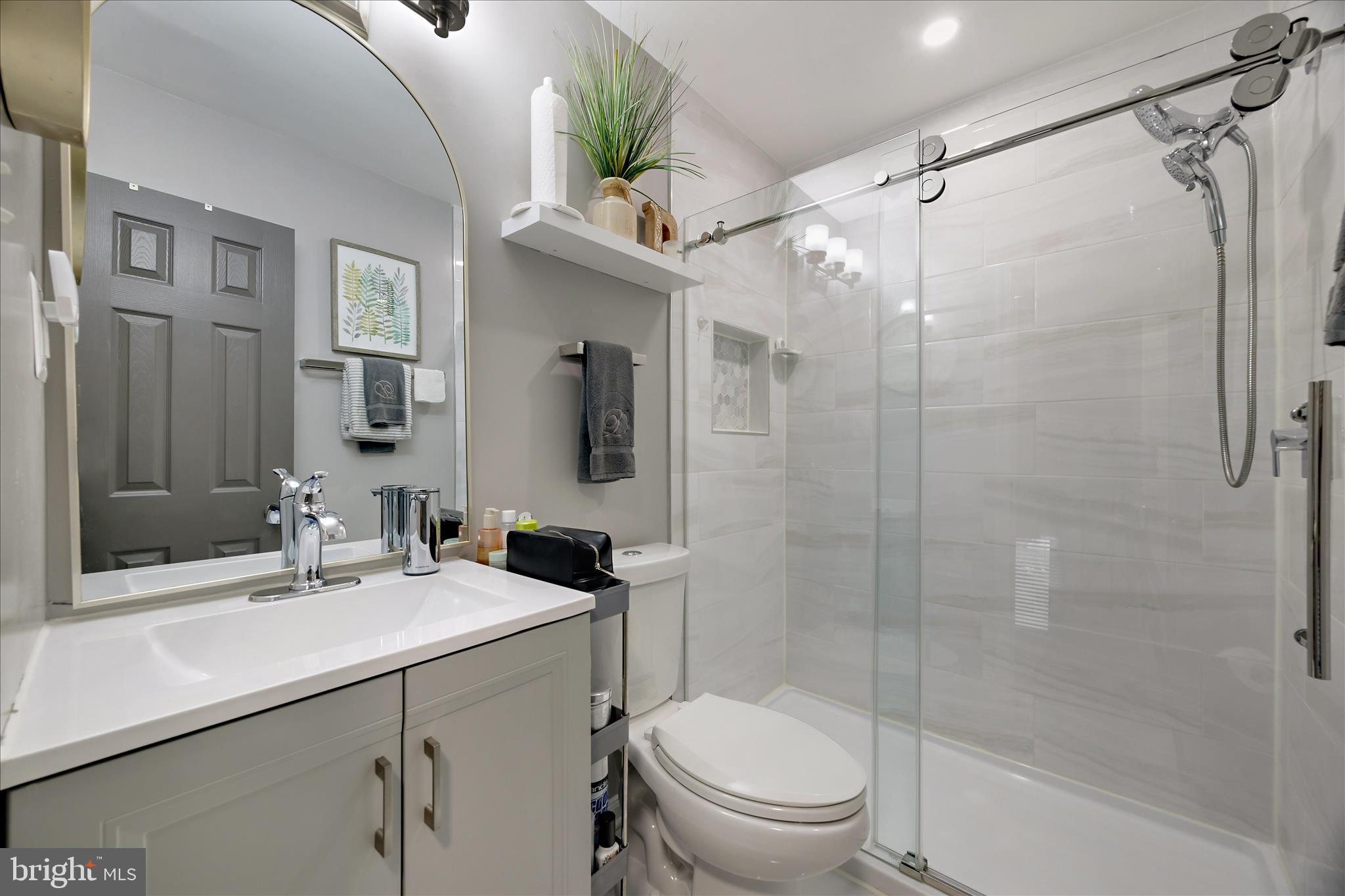 7314 Split Rail Lane Laurel, MD 20707 - Photo 26 of 32 a bathroom with a sink toilet and shower