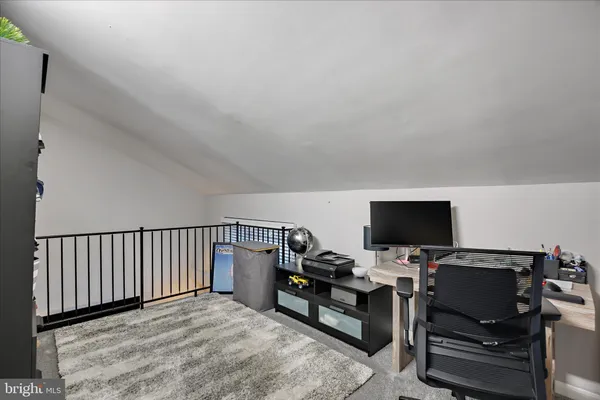 a bedroom with a workspace