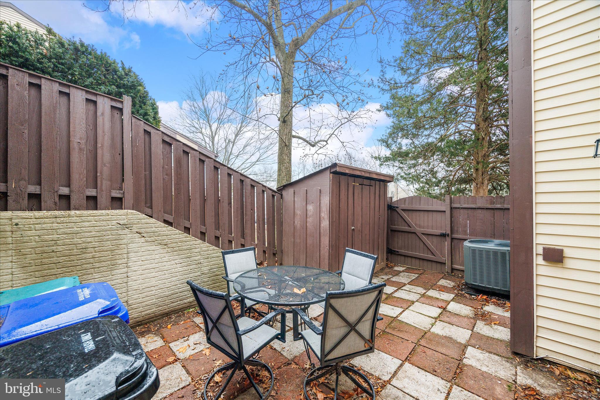 7314 Split Rail Lane Laurel, MD 20707 - Photo 31 of 32 a backyard of a house with table and chairs