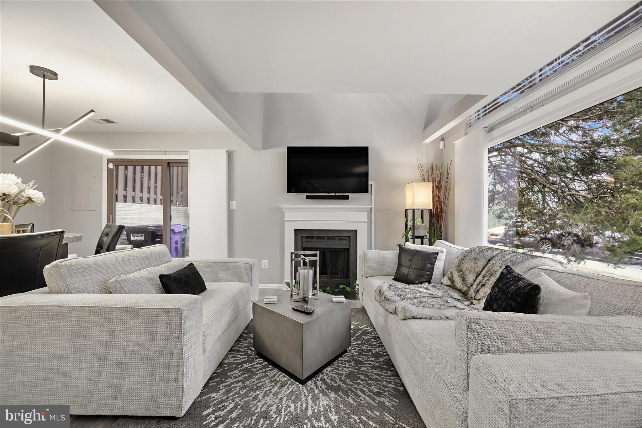 7314 Split Rail Lane Laurel, MD 20707 - Photo 7 of 32 a living room with furniture a fireplace and a flat screen tv