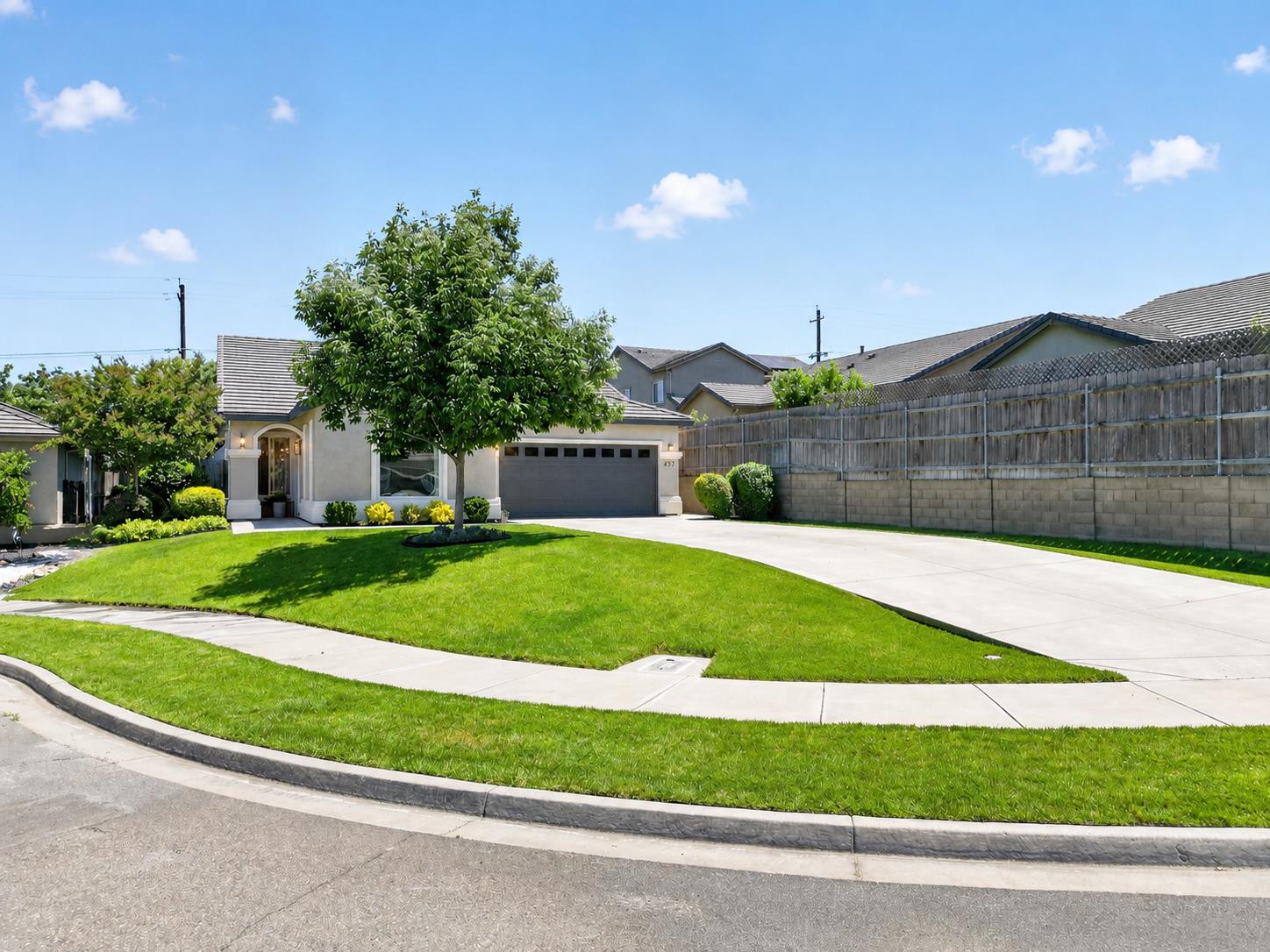 437 Silver Ridge Court Oakdale, CA 95361 - Photo 38 of 41 a front view of a house with a yard