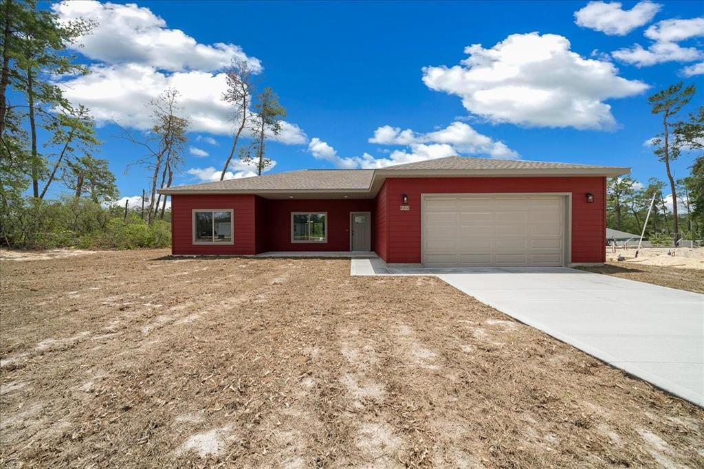 4312 Southwest 172nd Pl Road Ocala, FL 34473 - Photo 1 of 1 a front view of a building with entryway
