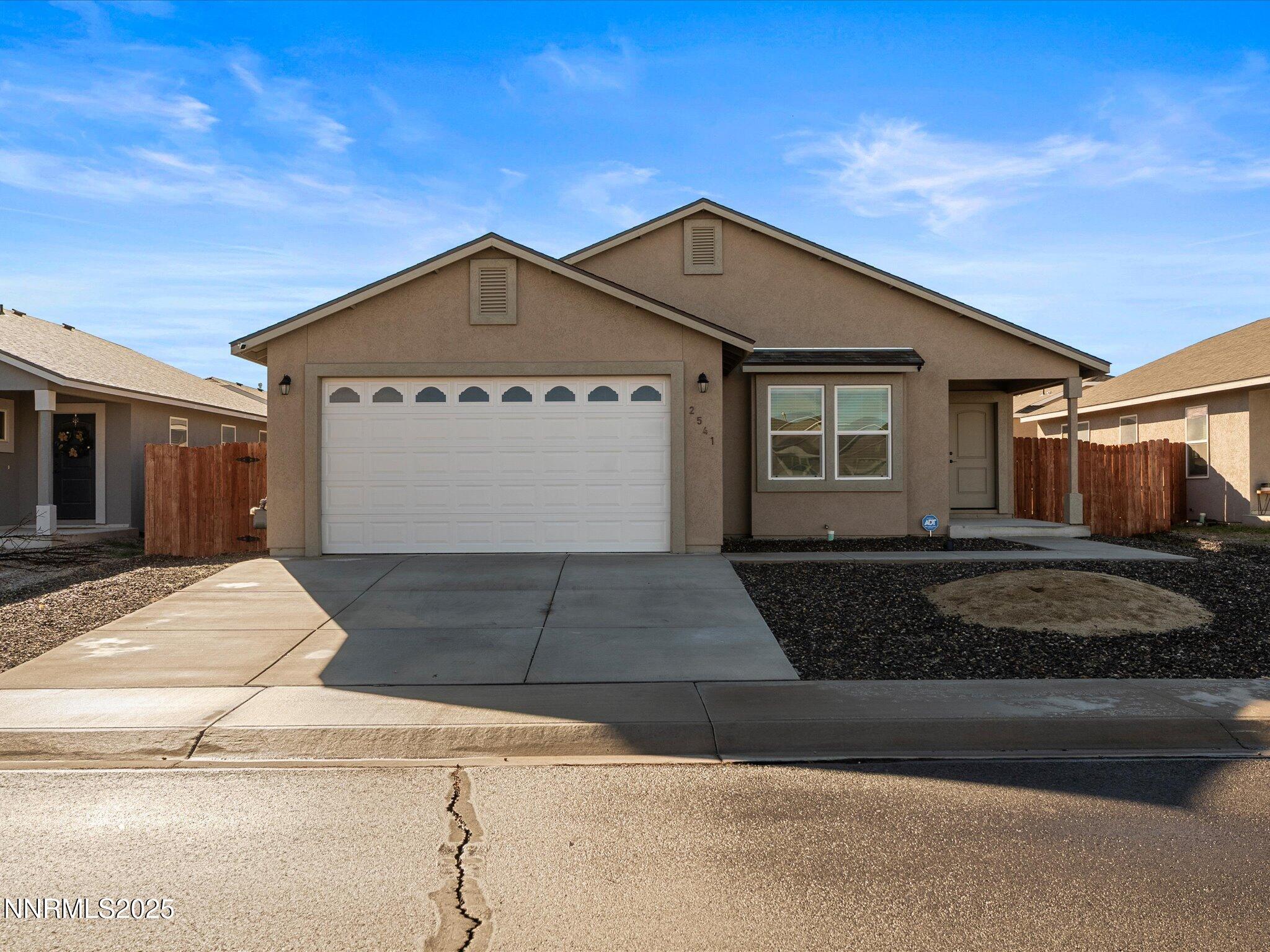 2541 Milano Way Fallon, NV 89406 - Photo 1 of 47 a front view of a house with yard