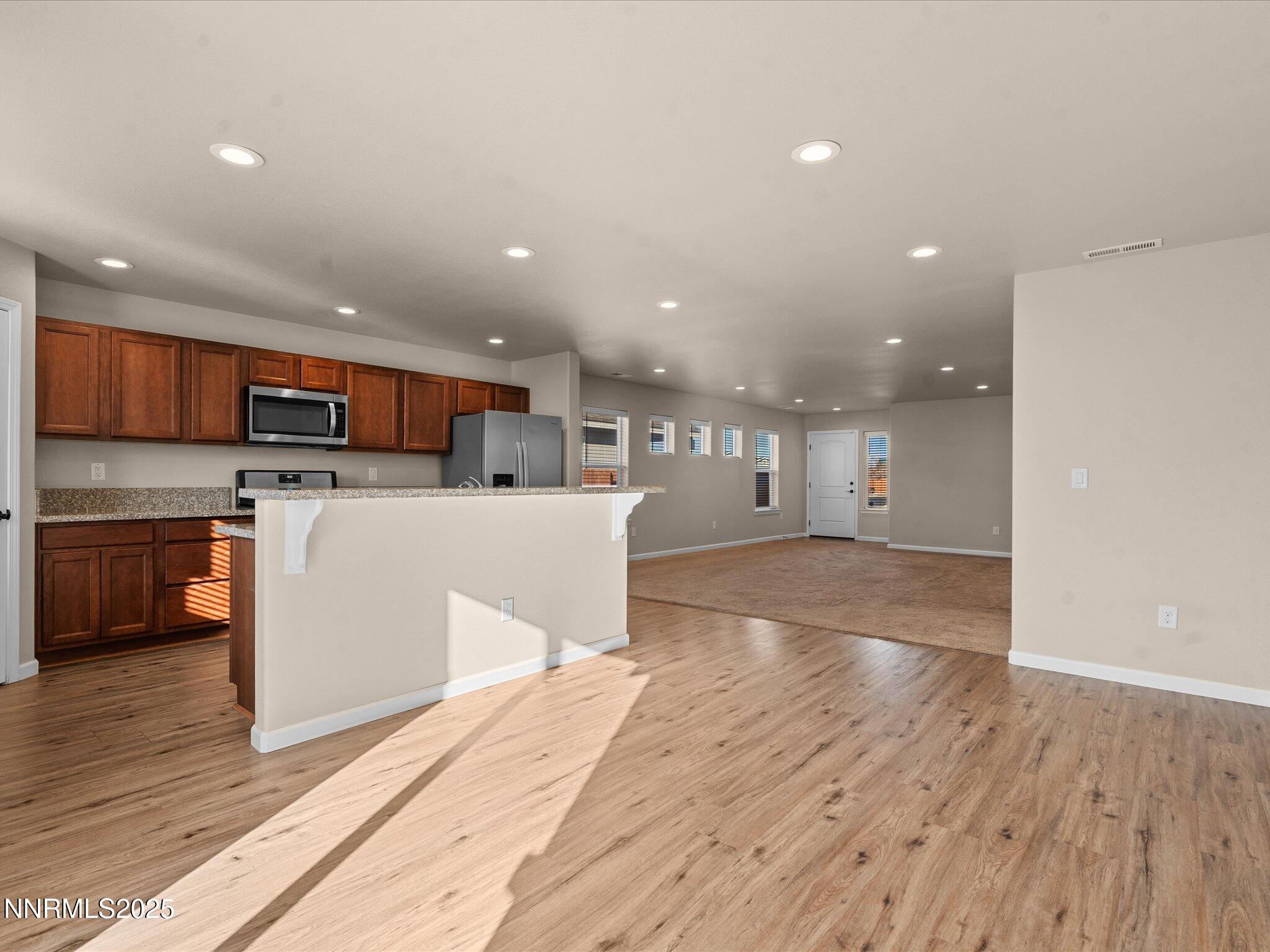 2541 Milano Way Fallon, NV 89406 - Photo 11 of 47 a view of kitchen with cabinets microwave and stove