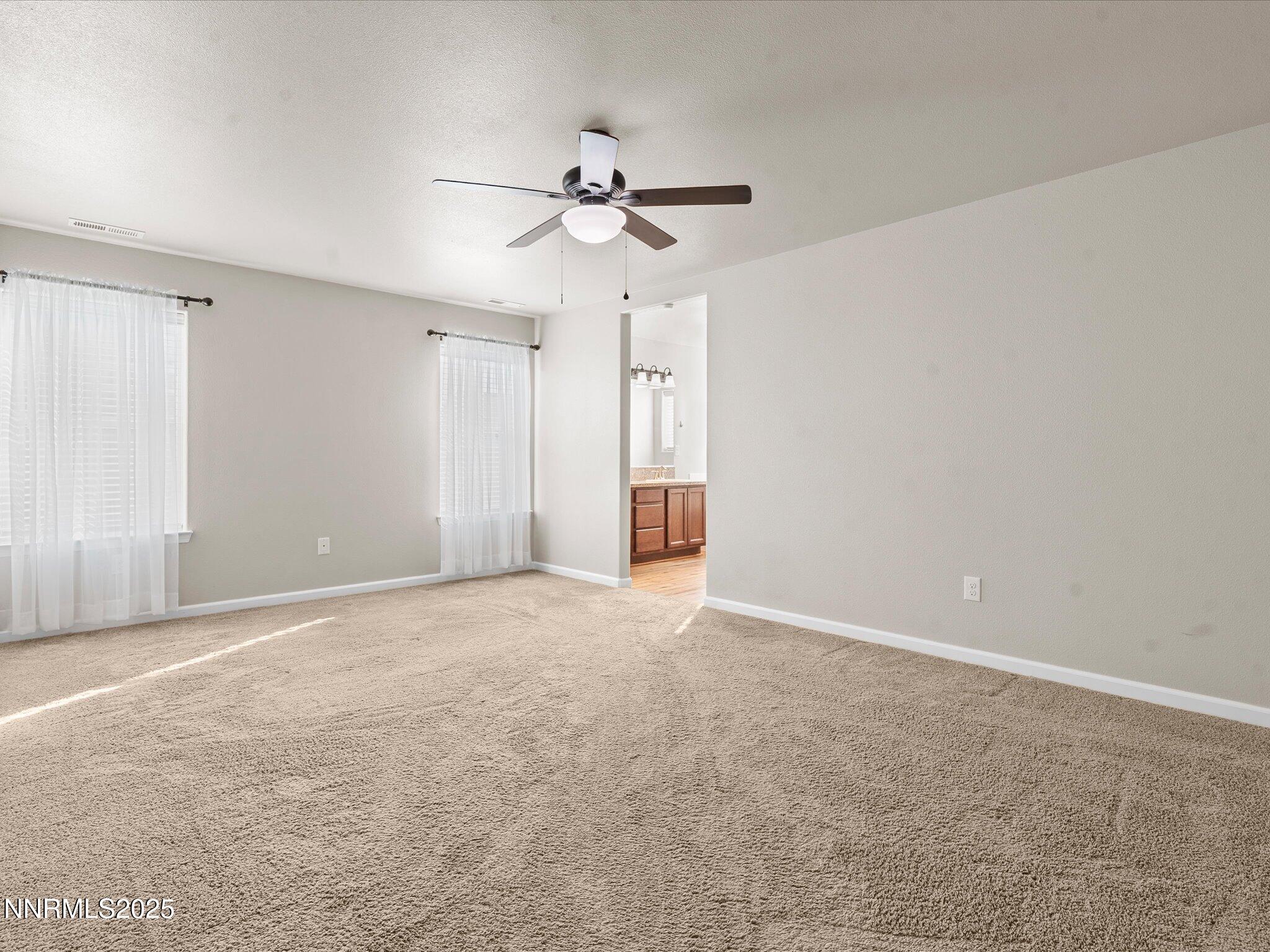 2541 Milano Way Fallon, NV 89406 - Photo 19 of 47 a view of empty room with ceiling fan