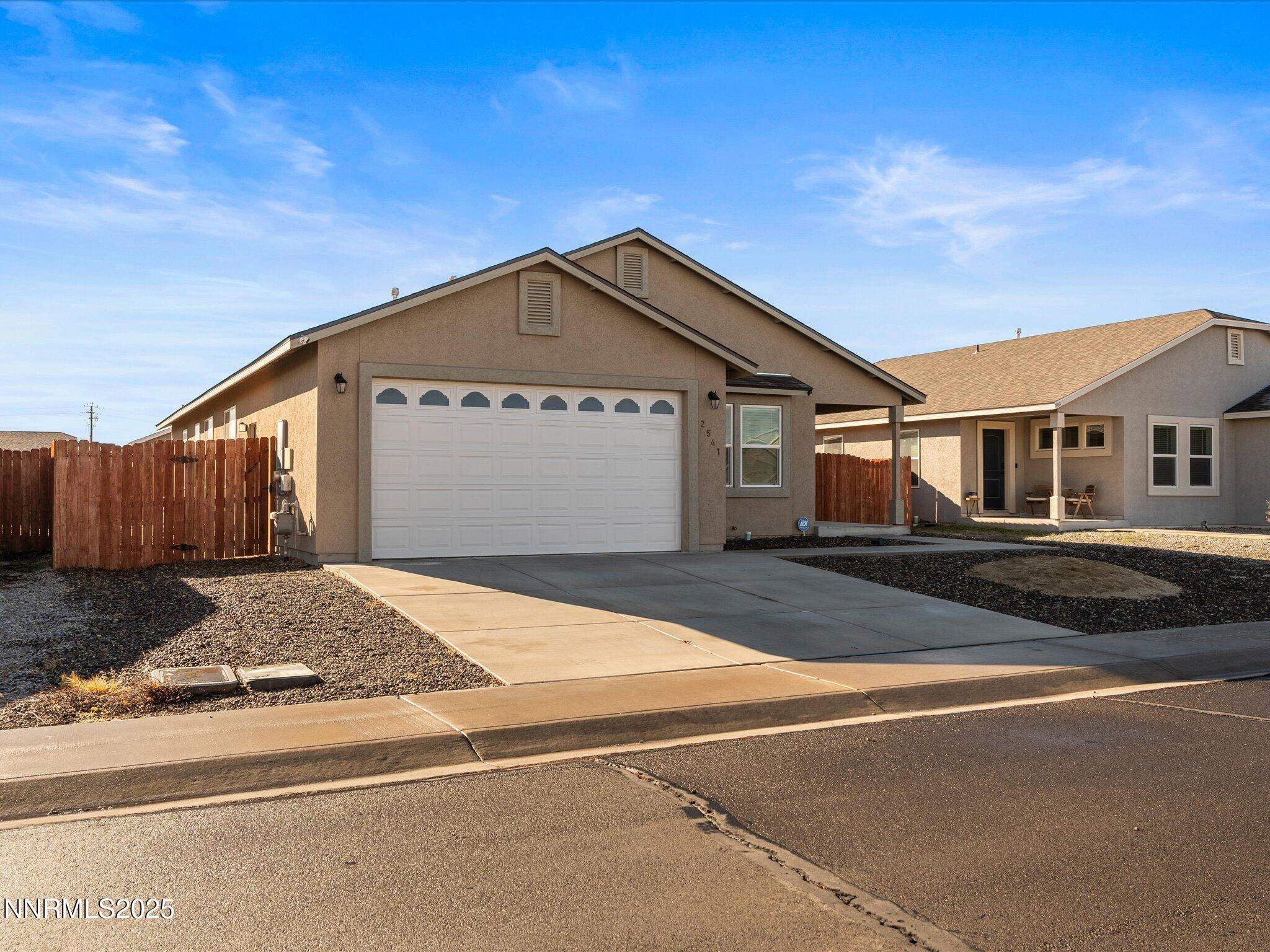 2541 Milano Way Fallon, NV 89406 - Photo 2 of 47 a front view of a house with yard