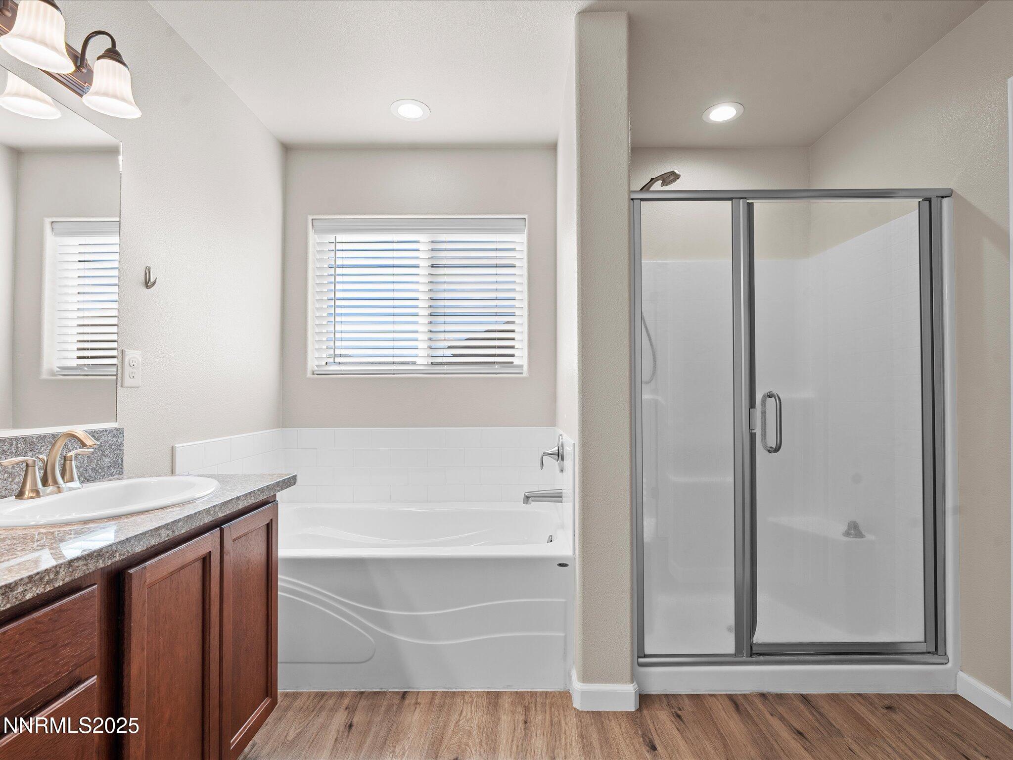 2541 Milano Way Fallon, NV 89406 - Photo 23 of 47 a bathroom with a tub a sink and a mirror