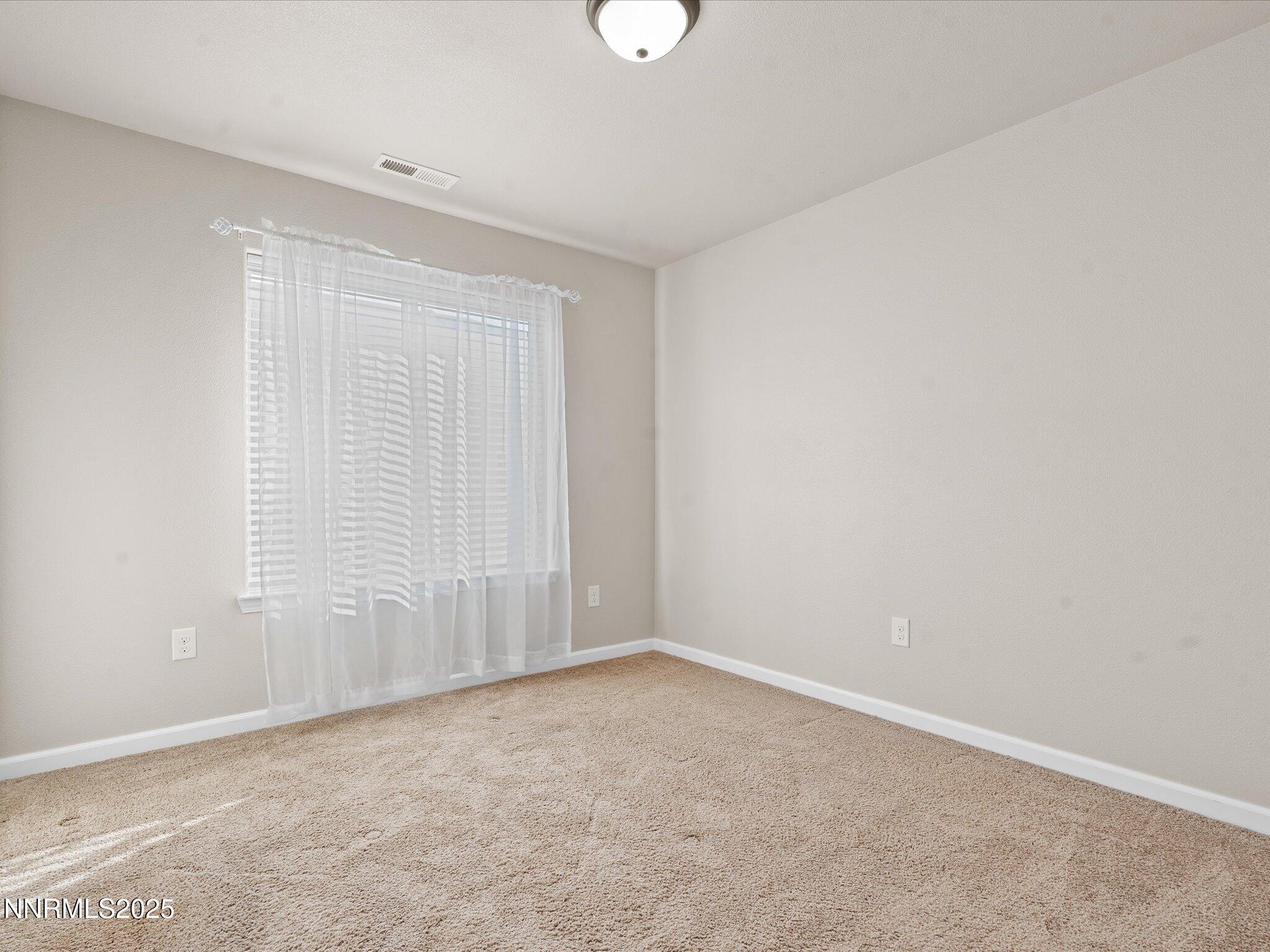2541 Milano Way Fallon, NV 89406 - Photo 30 of 47 an empty room with a empty space and window