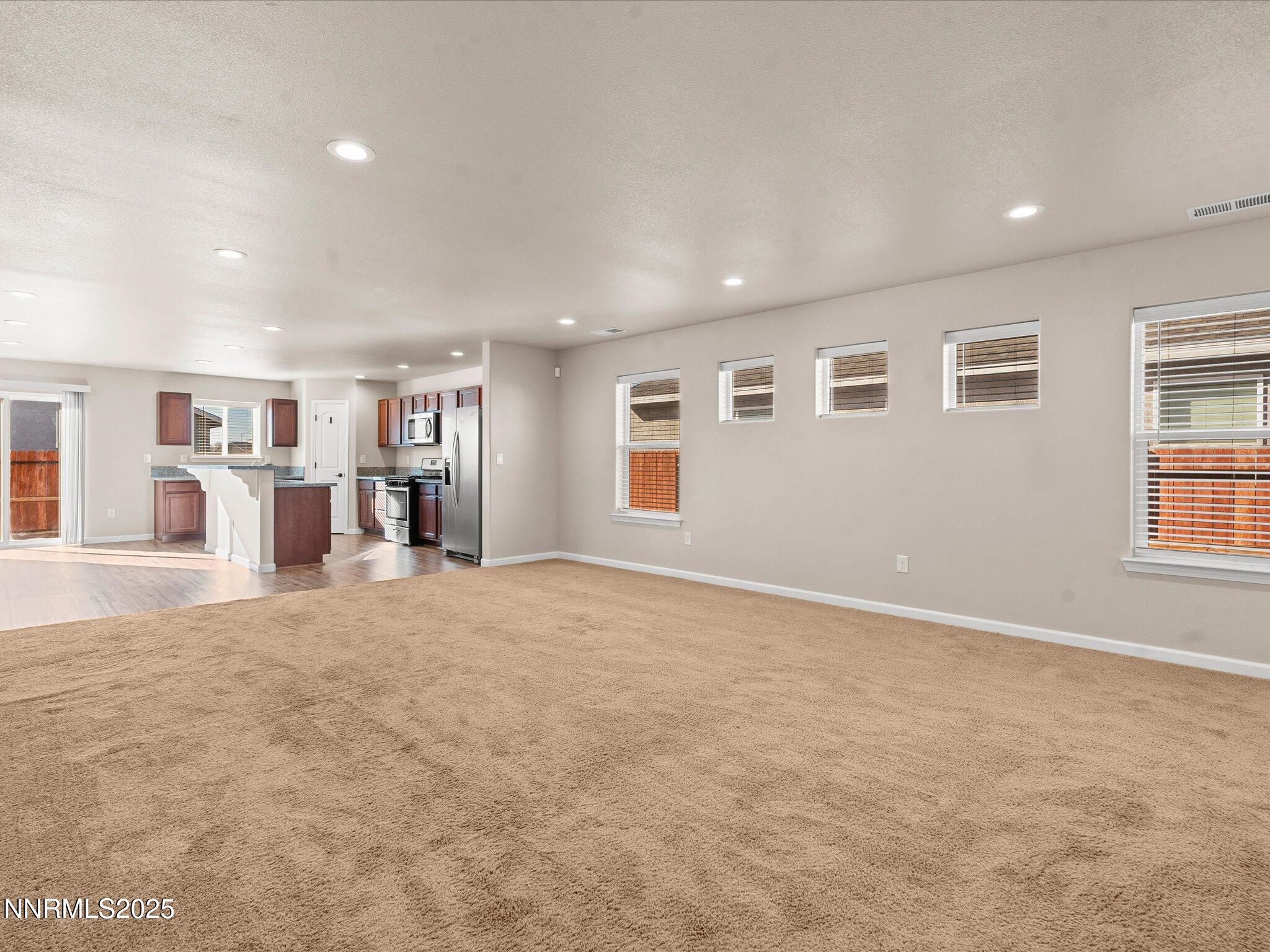 2541 Milano Way Fallon, NV 89406 - Photo 6 of 47 a view of an empty room with bookshelf