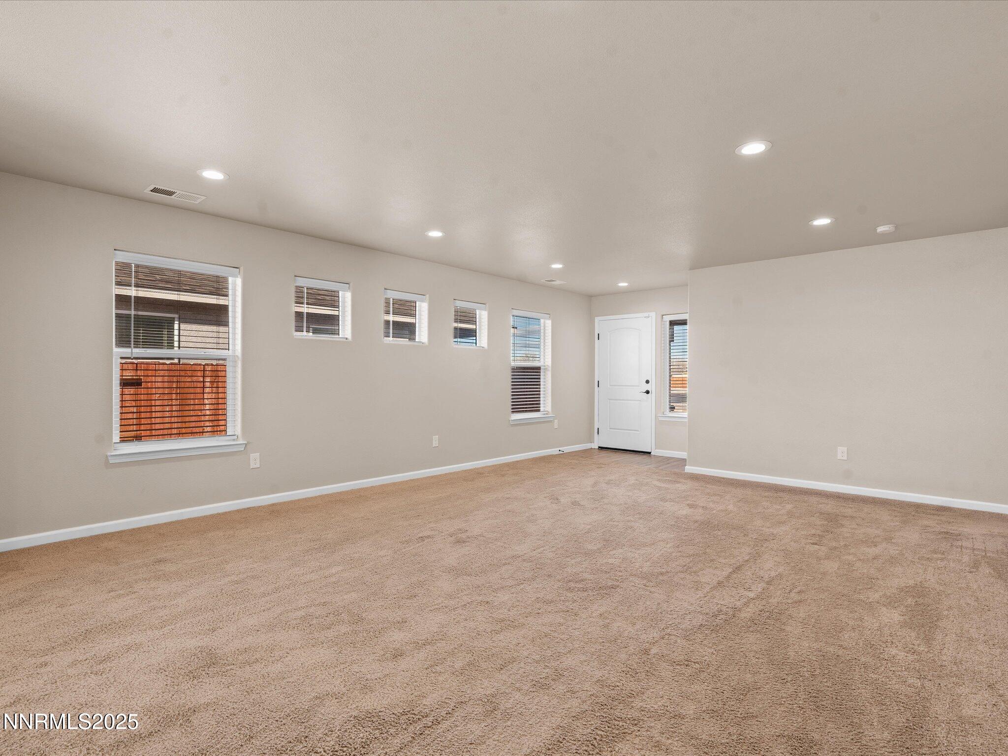 2541 Milano Way Fallon, NV 89406 - Photo 7 of 47 an empty room with windows
