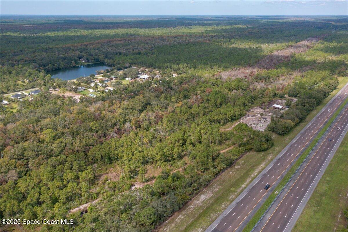 0 Blounts Ridge Road Mims, FL 32754 - Photo 7 of 9 a view of a lake from a balcony