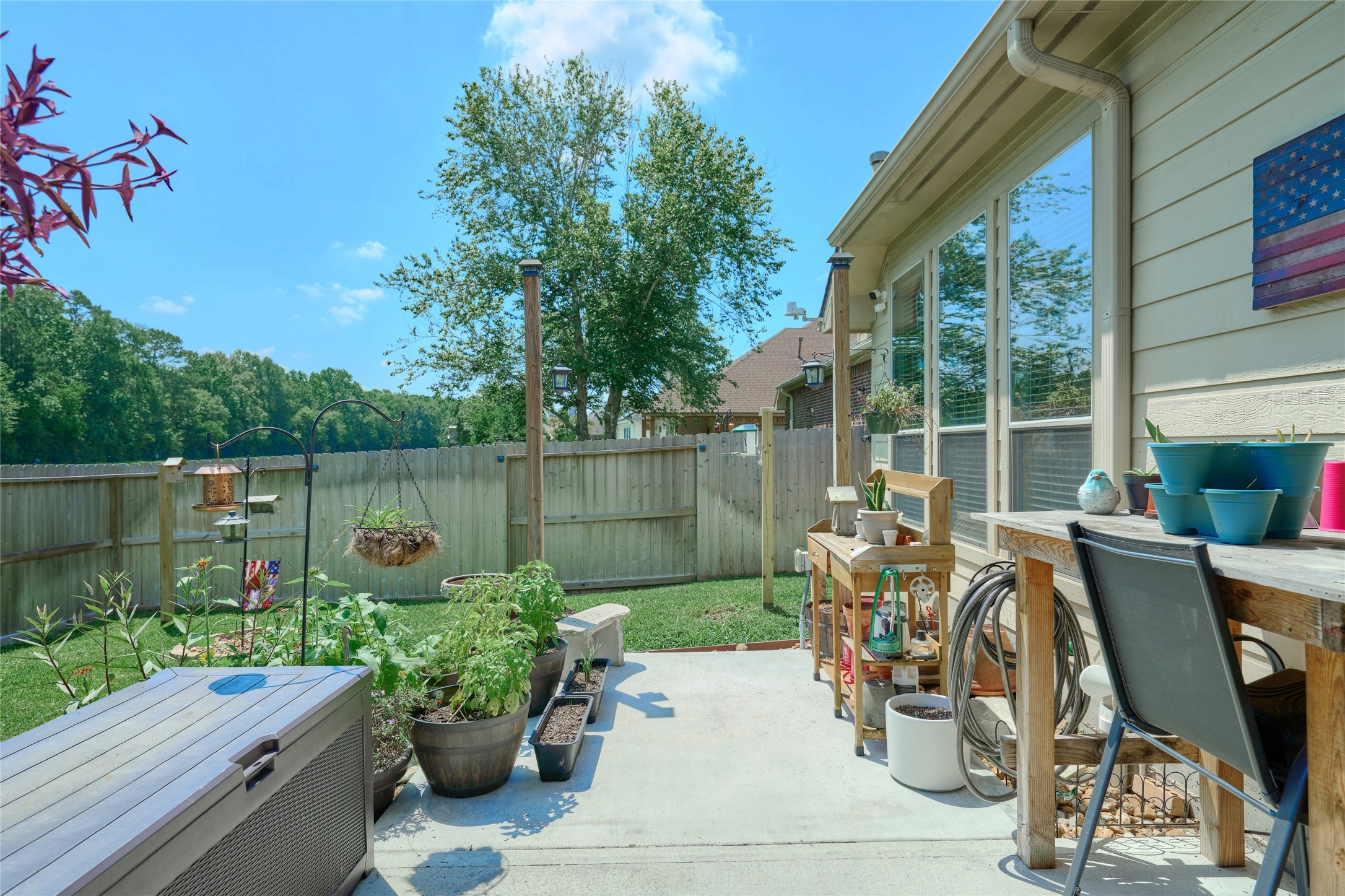 28322 Madelin Manor Lane Spring, TX 77386 - Photo 38 of 46 a view of a chair and table in backyard of the house