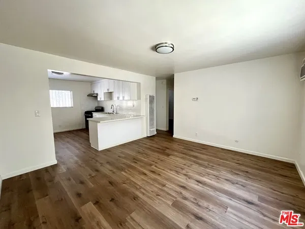a view of a kitchen with a sink and a stove top oven
