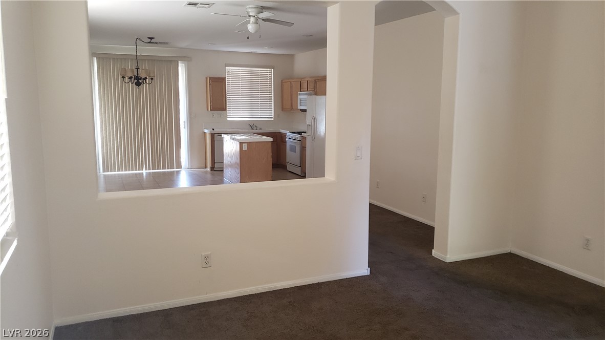 9112 Manalang Road Las Vegas, NV 89123 - Photo 49 of 50 An open floorplan connecting a comfortable living area to a practical kitchen space.