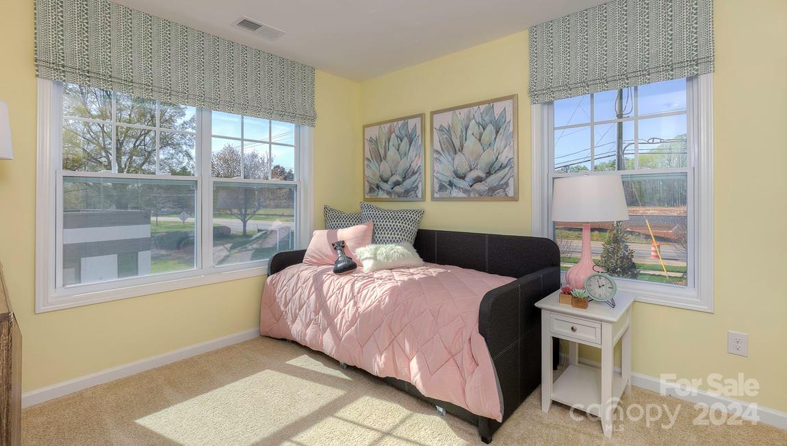 271 Creekview Road Hendersonville, NC 28792 - Photo 32 of 36 a bedroom with a bed and a painting on the wall