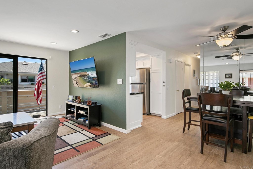 a view of a livingroom with furniture and a flat screen tv