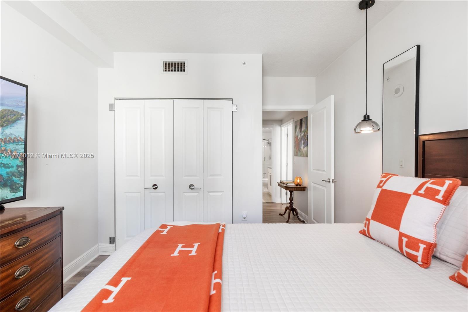 1250 South Miami Avenue, Unit 1206 Miami, FL 33130 - Photo 12 of 19 a bedroom with a bed and a dresser in it