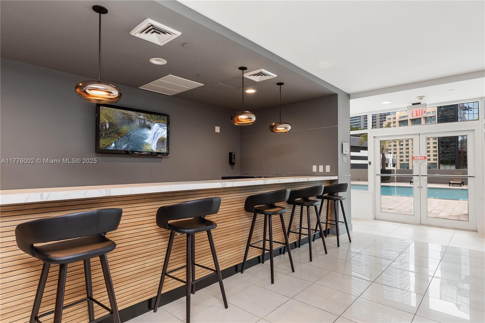 1250 South Miami Avenue, Unit 1206 Miami, FL 33130 - Photo 18 of 19 a view of a dining room with furniture and chandelier