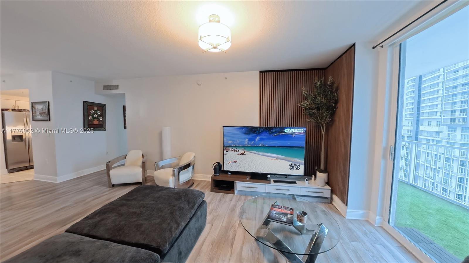 1250 South Miami Avenue, Unit 1206 Miami, FL 33130 - Photo 4 of 19 a living room with furniture and a wooden floor