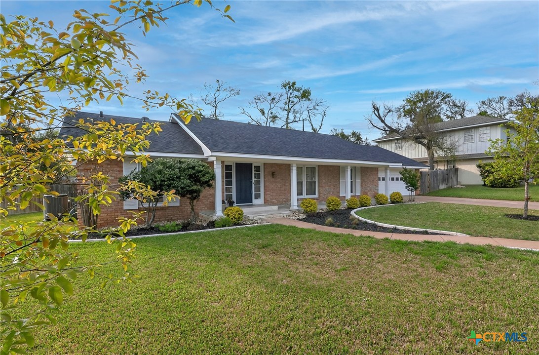 3102 Las Cruces Boulevard Temple, TX 76502 - Photo 2 of 37 a front view of a house with a yard