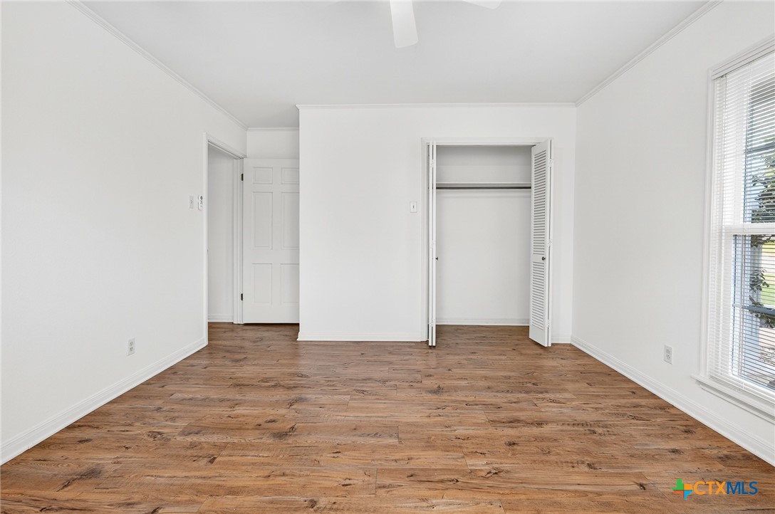 3102 Las Cruces Boulevard Temple, TX 76502 - Photo 23 of 37 a view of an empty room with wooden floor and a window